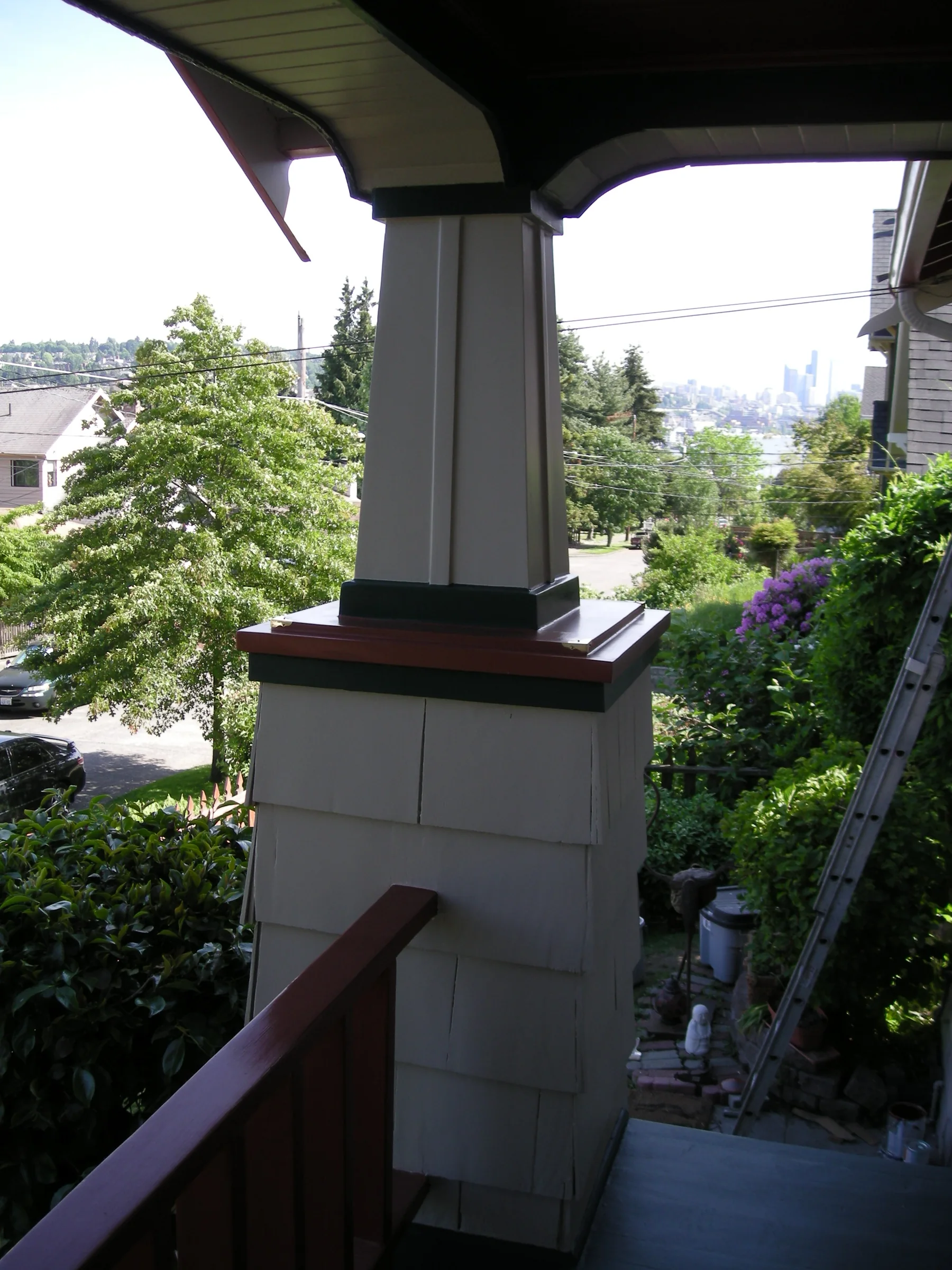 Finished home restoration porch and angled stair rail